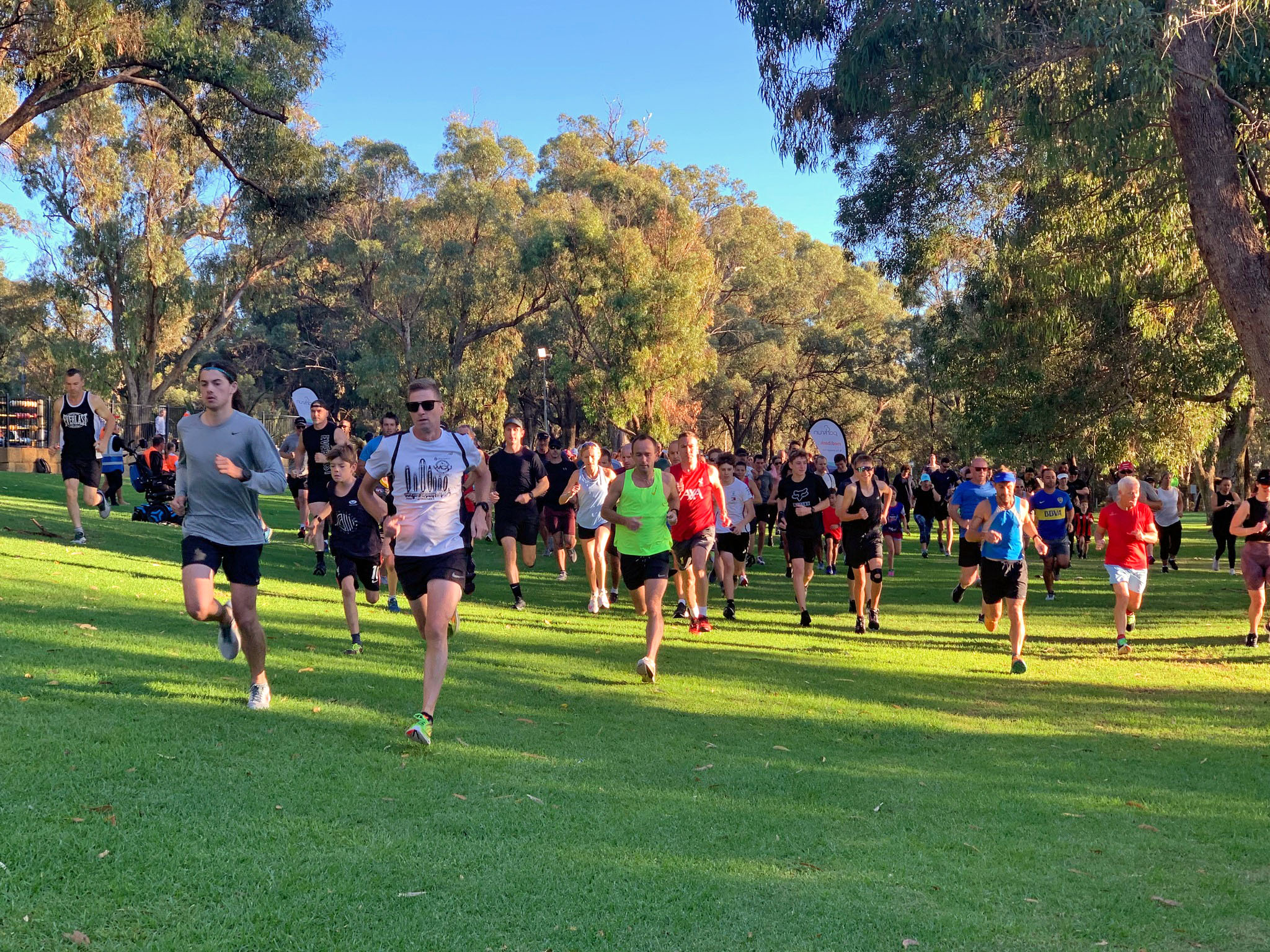 Group of runners running in the park