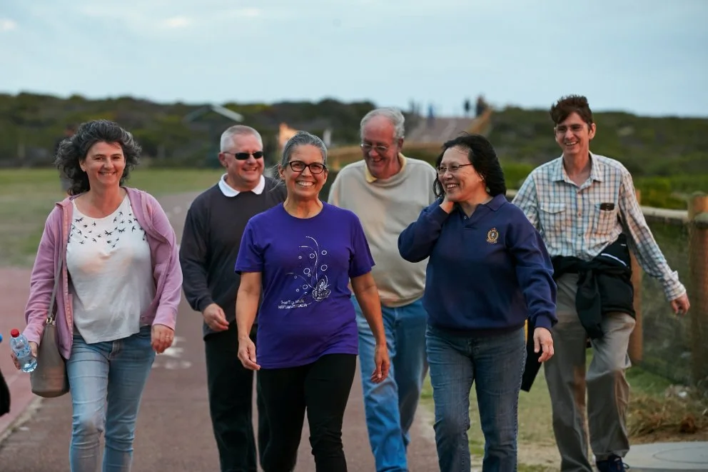 Group of people walking and enjoying each other's company