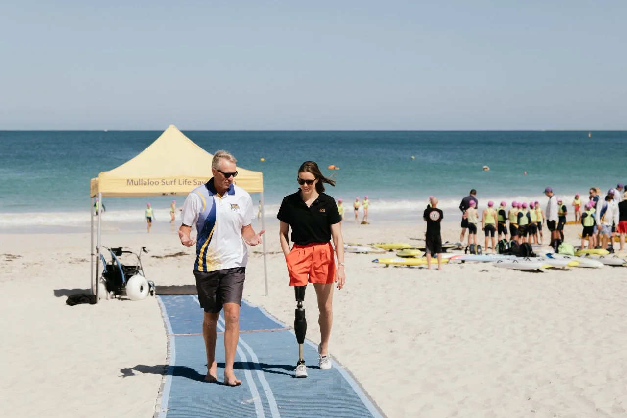 lady walking on beach matting