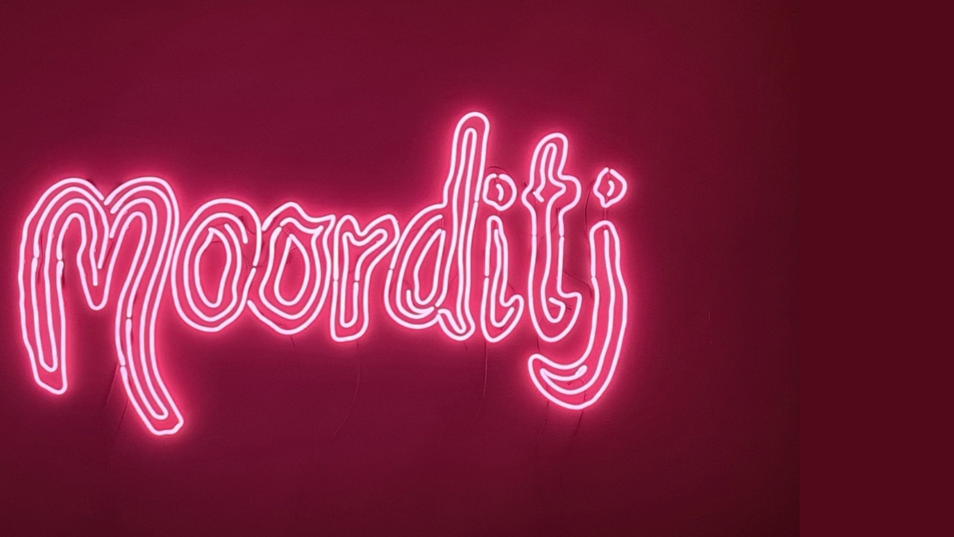 Pink neon sign spelling 