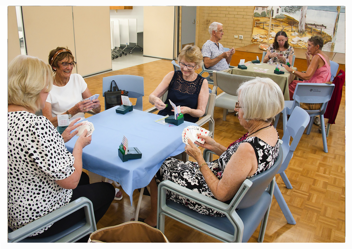 Group of seniors playing cards