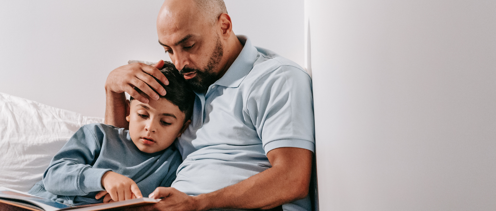 Father and son reading a book