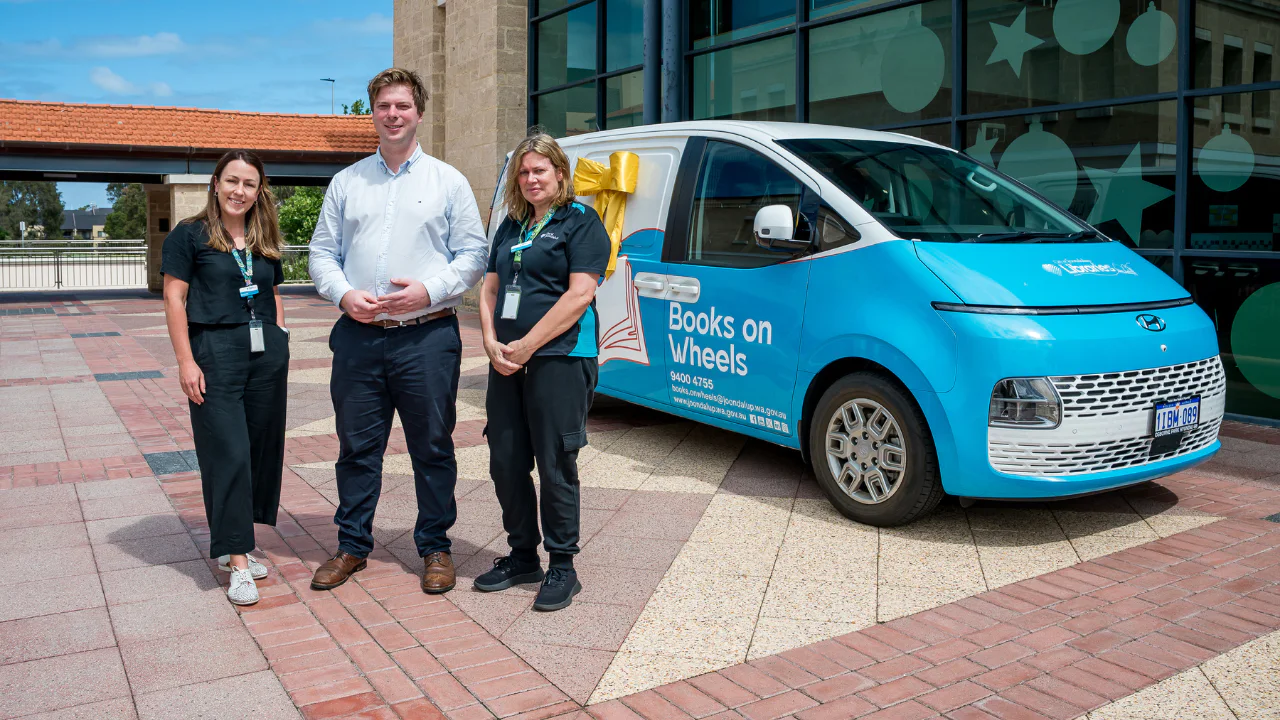 Books on wheels staff with Mayor in front of van