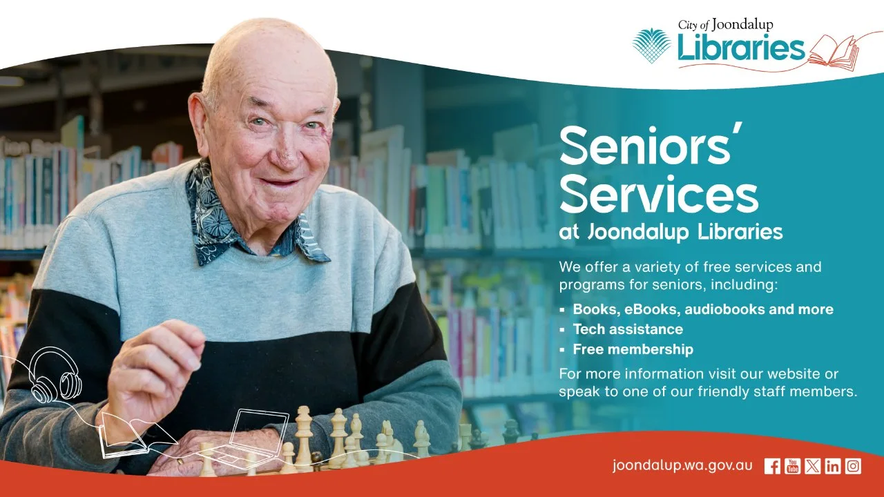 Older man sitting in the library