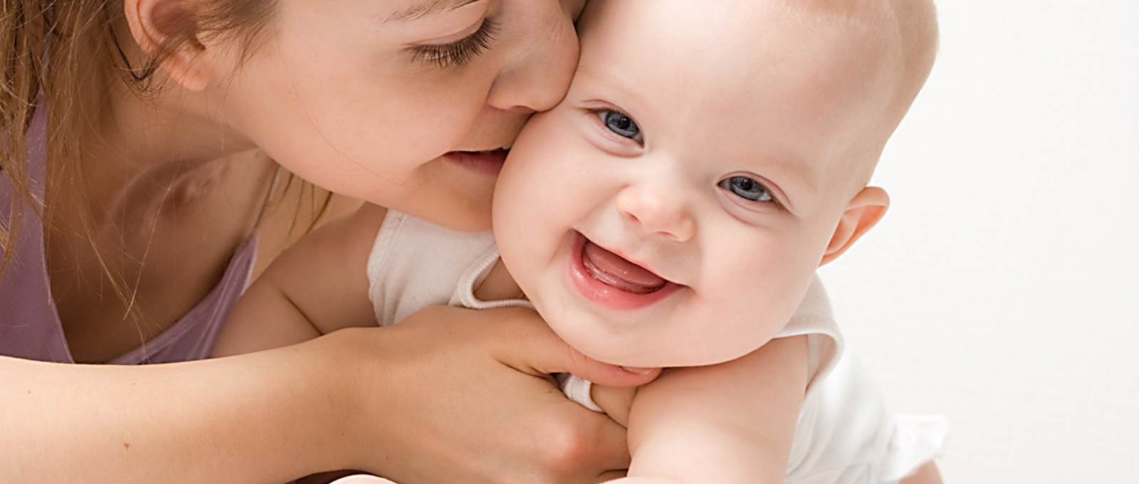 Parent and baby participating in a baby massage workshop..