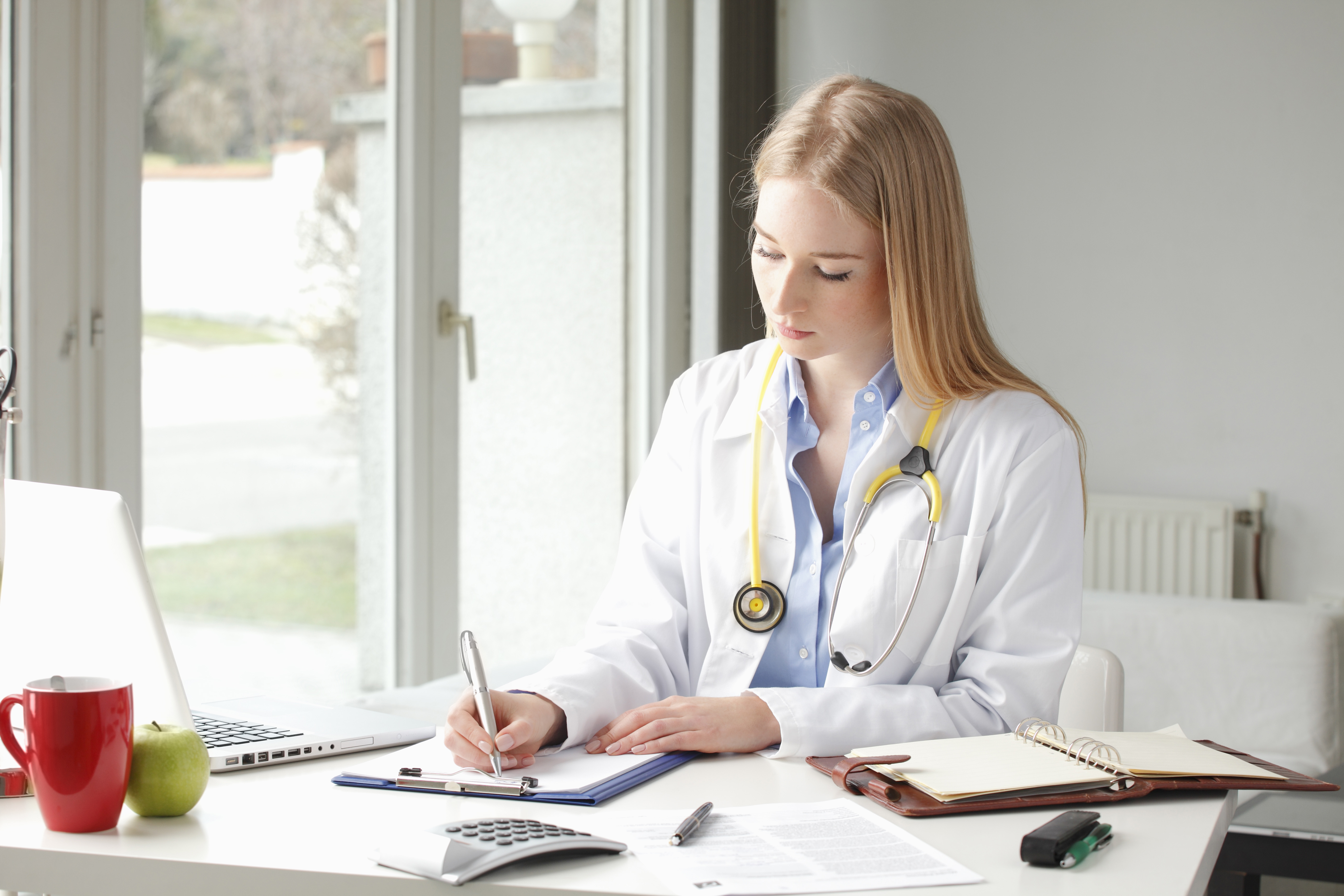 Female doctor sitting at her desk