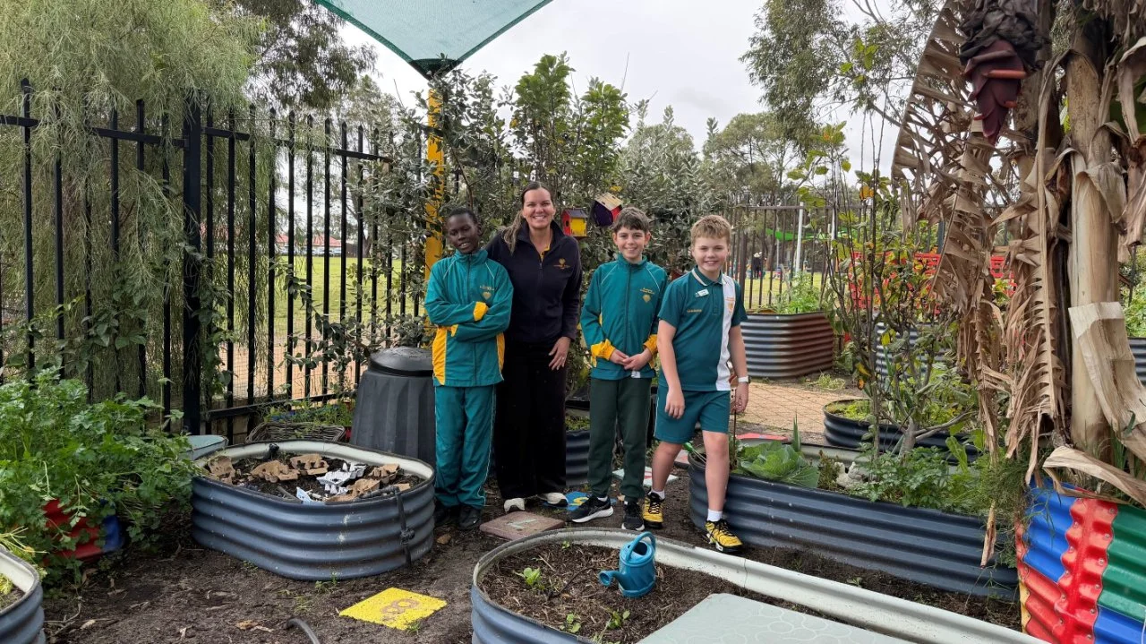 Staff member and students in the Joondalup Education Support Centre garden