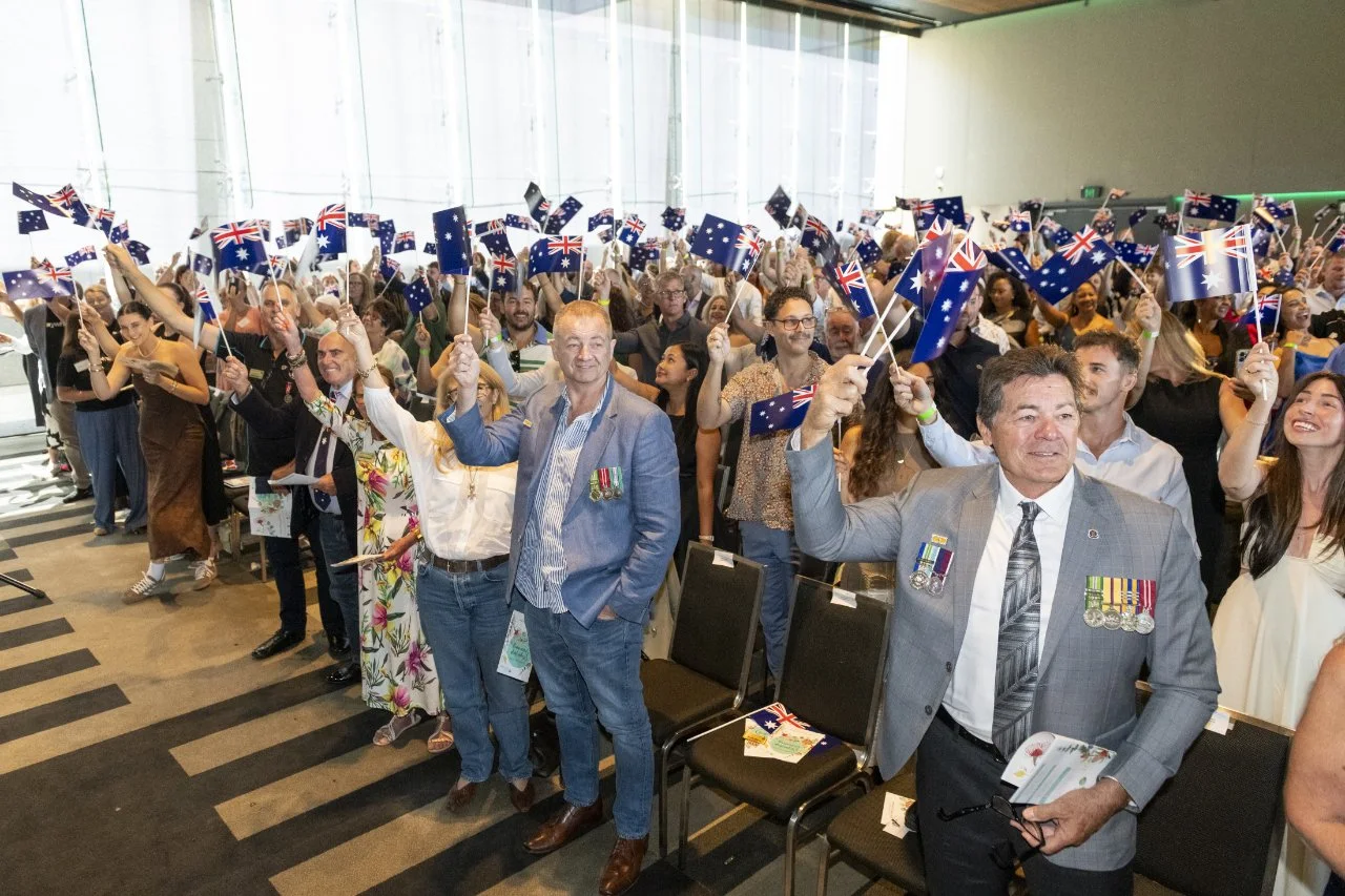 australia day ceremony waving flags