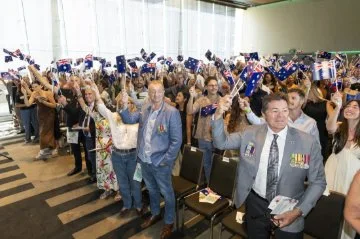 australia day ceremony waving flags