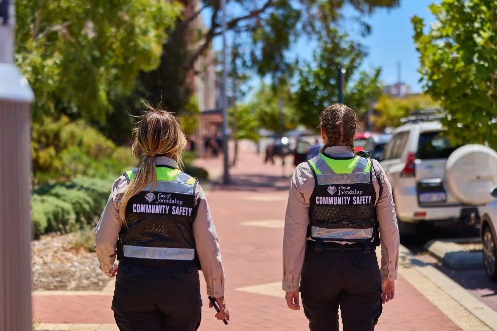 safety officer wiith dog at park