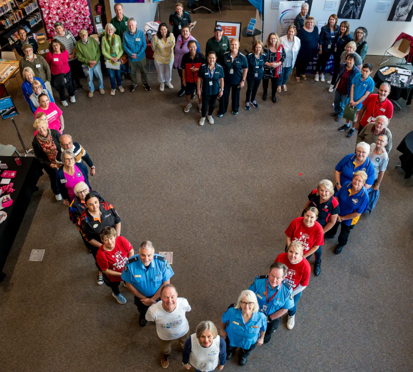 Photo of volunteer helping with planting